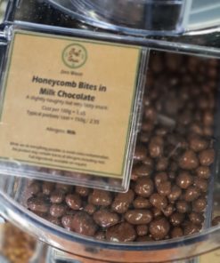 Chocolate honeycomb bites pieces in the plastic free snacks and treats section Just Gaia zero waste grocery in Halifax, West Yorkshire