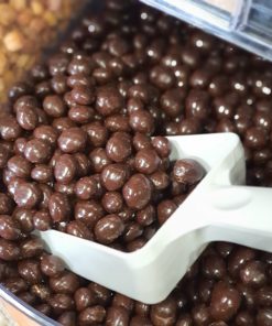 Dark chocolate coffee beans scoop in the plastic free snacks and treats section Just Gaia zero waste grocery in Halifax, West Yorkshire