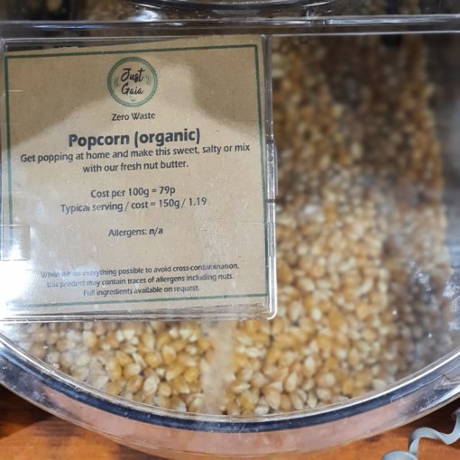 Organic popcorn kernels dispenser in the plastic free snacks and treats section Just Gaia zero waste grocery in Halifax, West Yorkshire
