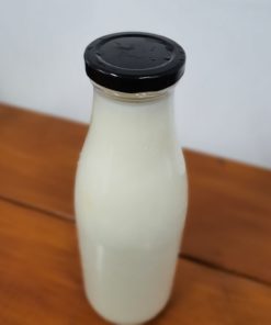 Organic Semi-skimmed milk bottle in the plastic free snacks and treats section Just Gaia zero waste grocery in Halifax, West Yorkshire