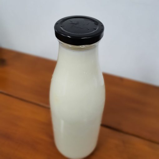 Organic Semi-skimmed milk bottle in the plastic free snacks and treats section Just Gaia zero waste grocery in Halifax, West Yorkshire