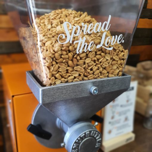 Freshly peanut butter machine at Just Gaia zero waste grocery in Halifax, West Yorkshire