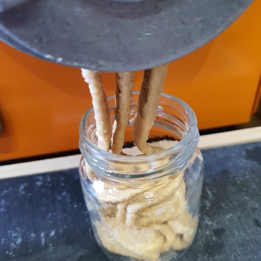Freshly peanut butter being made at Just Gaia zero waste grocery in Halifax, West Yorkshire