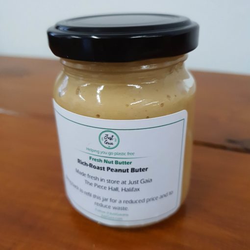Freshly peanut butter labeled jar at Just Gaia zero waste grocery in Halifax, West Yorkshire