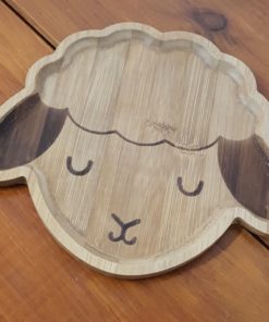 Bamboo children's plates (Lamb shape close up) on display in Just Gaia Halifax.