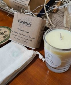 Close up of soy candle and turmeric soap in Luxury Bathroom Pamper Gift Set at Just Gaia, UK