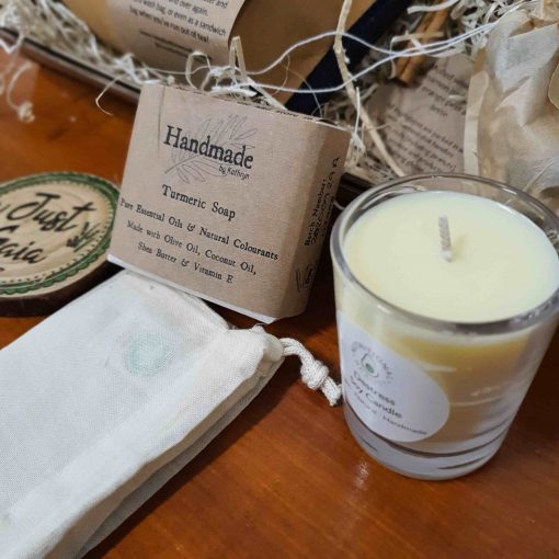Close up of soy candle and turmeric soap in Luxury Bathroom Pamper Gift Set at Just Gaia, UK