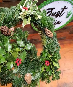 Organic handmade Christmas Wreath as part of our Christmas decorations at Just Gaia Halifax. Shown here in store.